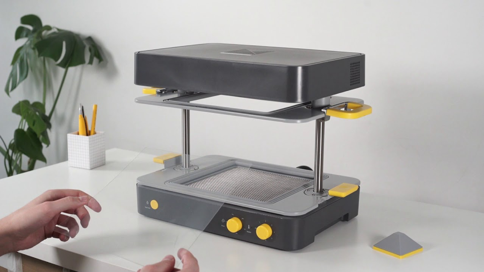 the makyku formbox 3D desktop vacuum former sitting on a table