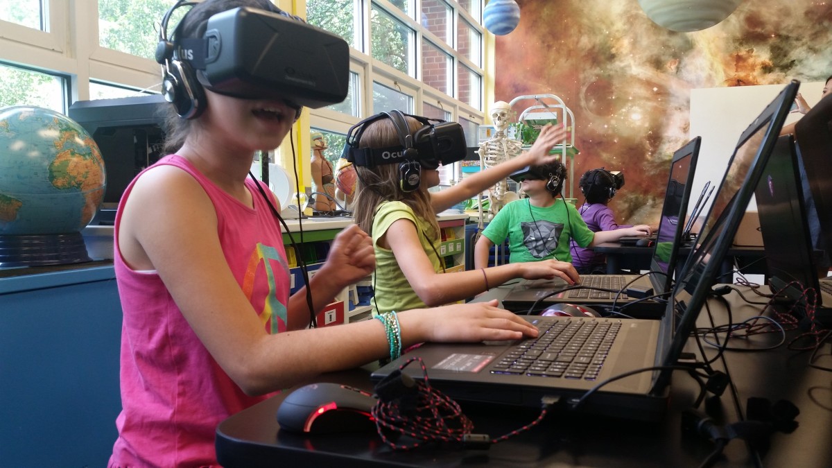 a student using a virtual reality headset to explore the solar system in the classroom