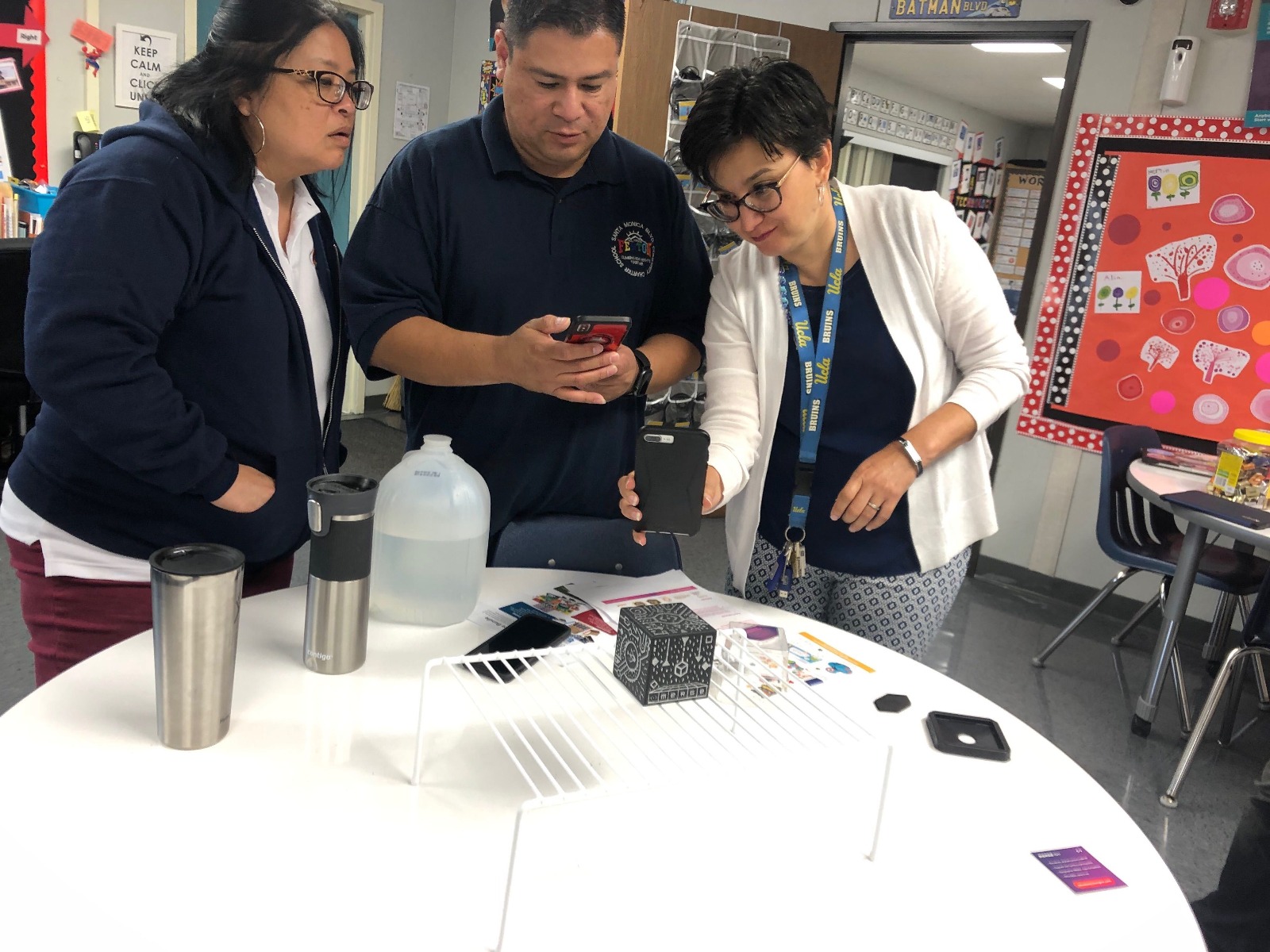 educators at the santa monica charter school looking at the merge cube in the classroom