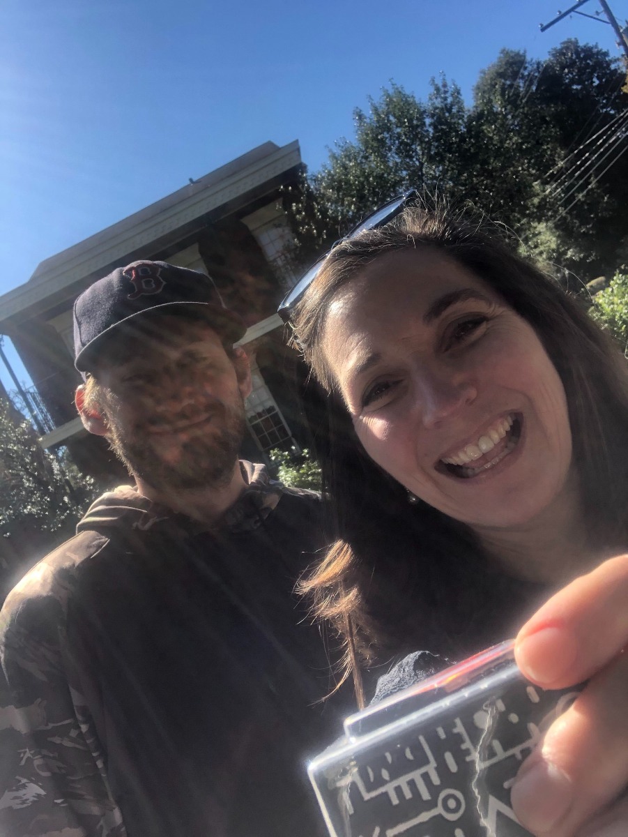 a teacher poses with the Merge Cube after receiving a donation in alabama