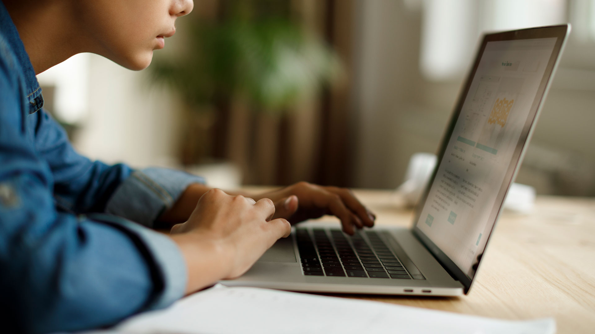 a hybrid learning students looks at a computer screen during a lesson