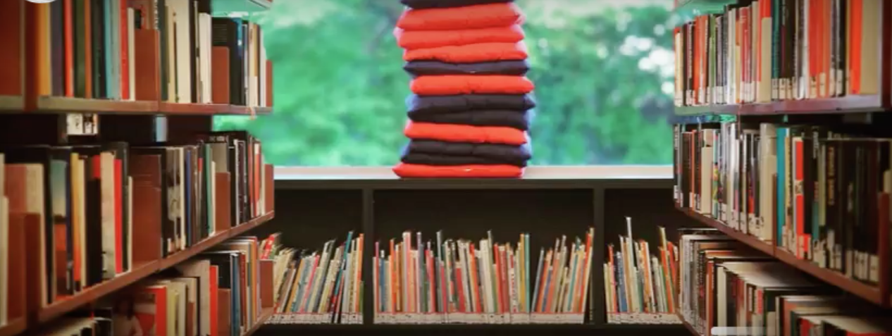 a school library aisle with books on the shelves