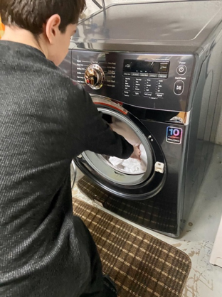 a special ed student working on a car