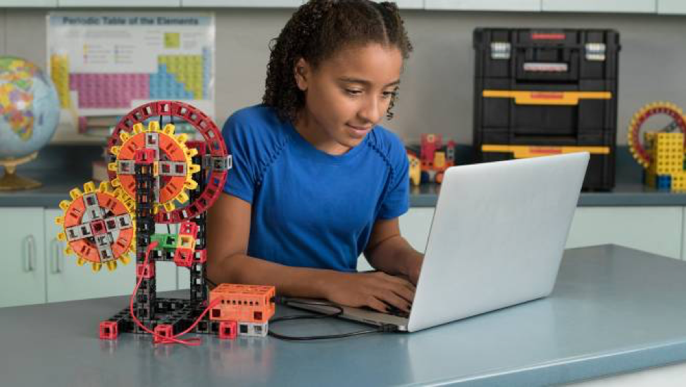 a student setting up code for a kid spark invention