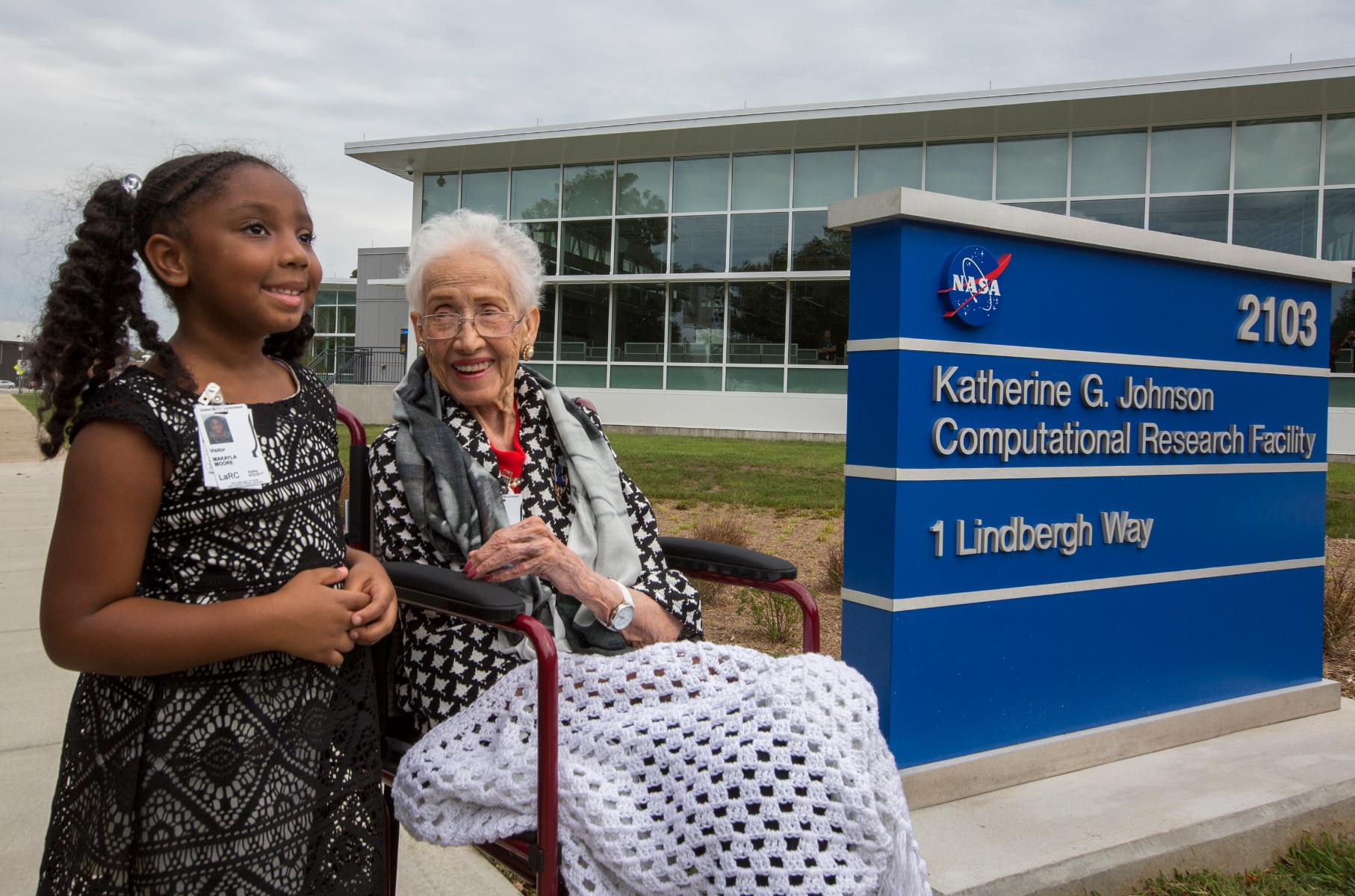 nasa's katherine johnson sitting in a wheelchair outside the research facility named in her honor