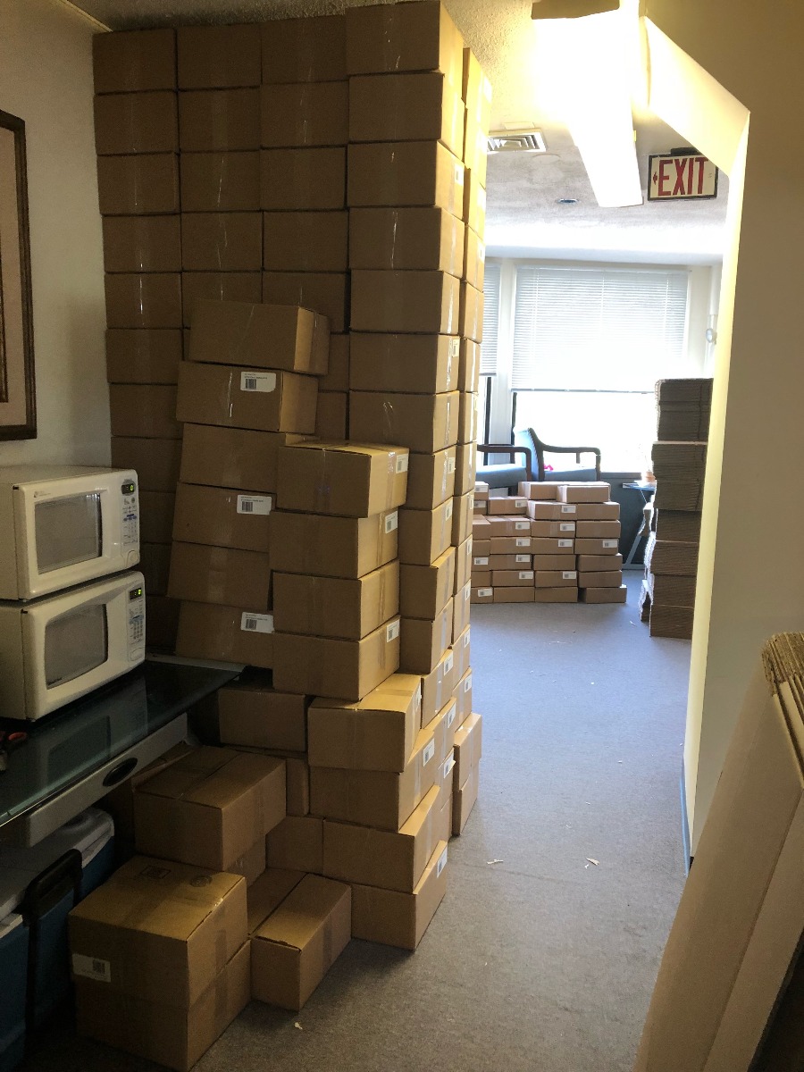 STEM kits packed in boxes awaiting shipment to an afterschool program