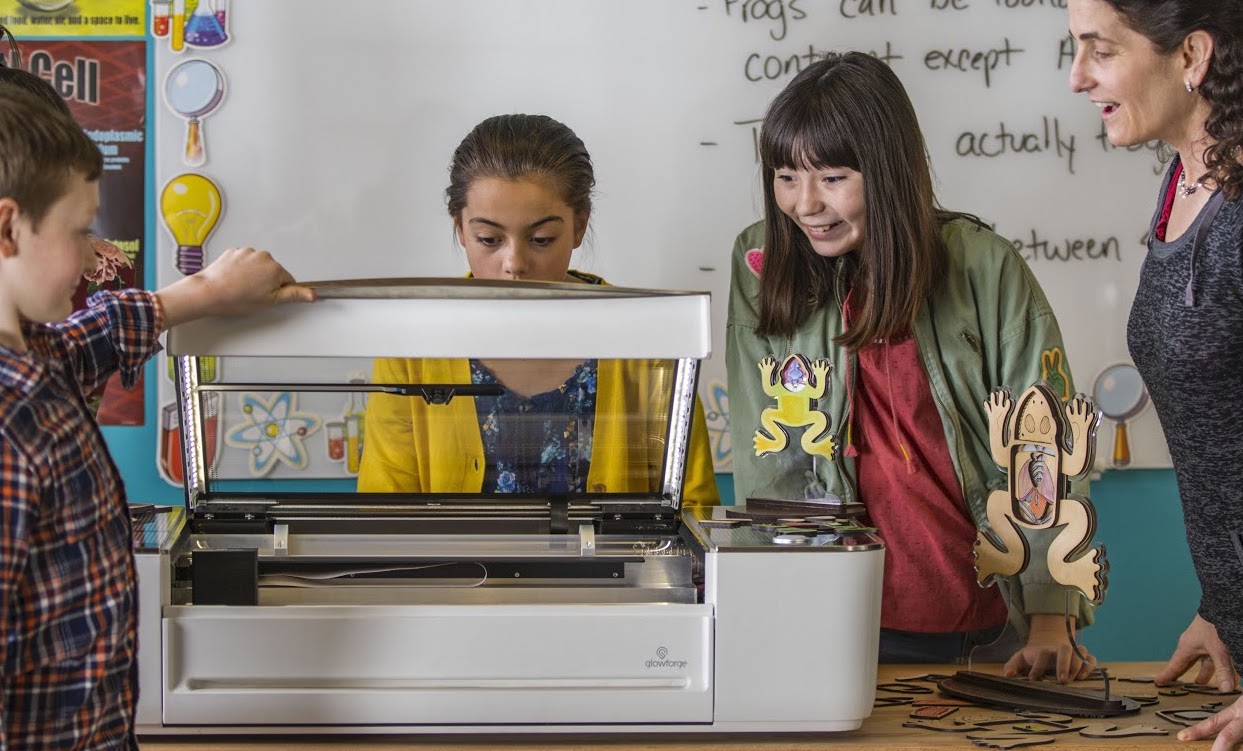 Students using the Glowforge 3D laser printer