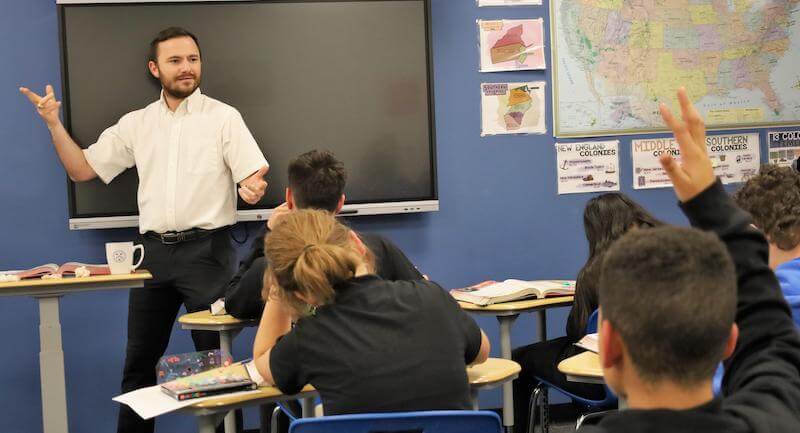 a charter school teacher leading a lesson with students