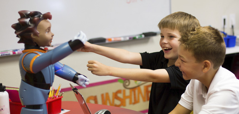 students interacting with robokind's milo robot in the classroom