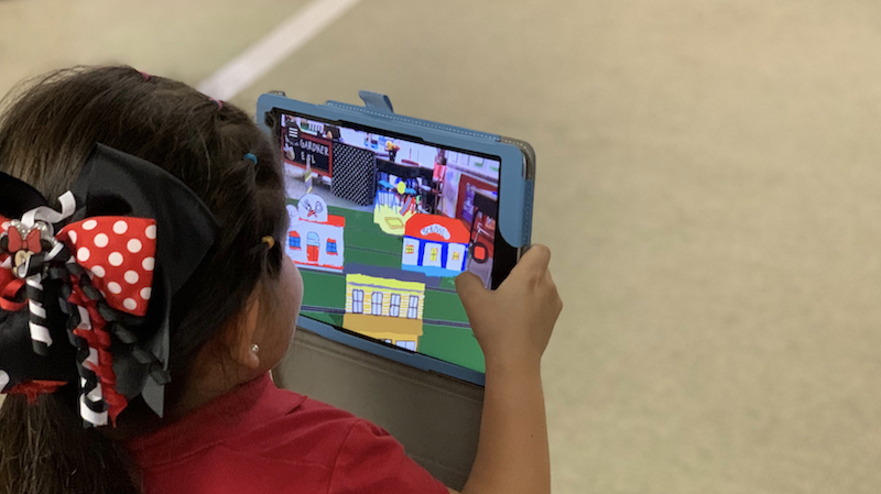 an ESL student works with an AR app on a tablet