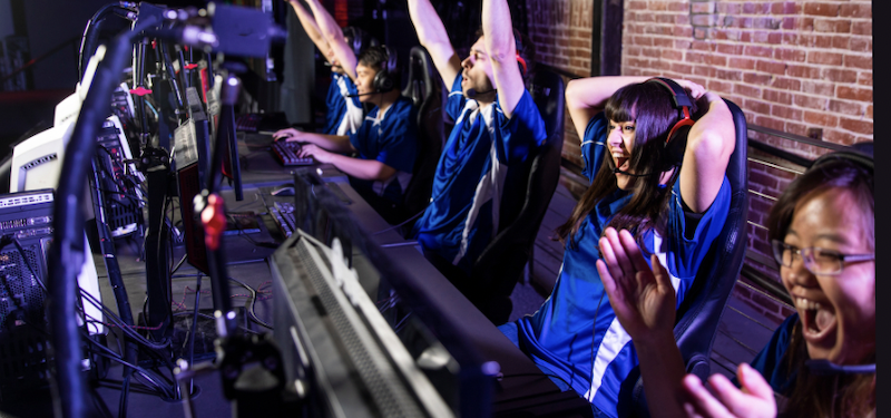 students celebrating team success in an esports competition