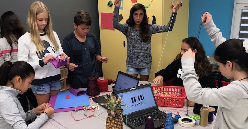students working together on a project in a school makerspace
