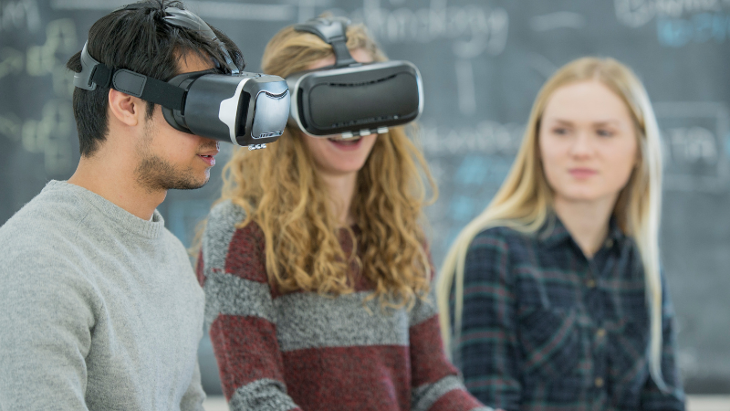 students using virtual reality headsets in the classroom