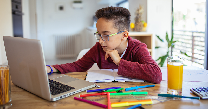 a student working on a current events project and making a connection between PBL and real life