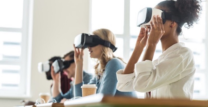 students wearing VR headsets while learning in the classroom 