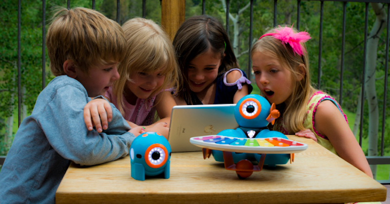 young students completing a STEM lesson with Wonder Workshop's Dash and Dot Robot