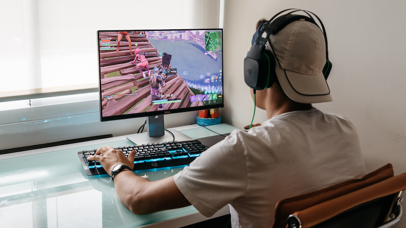 a student gamer playing a video game as part of a school esports program