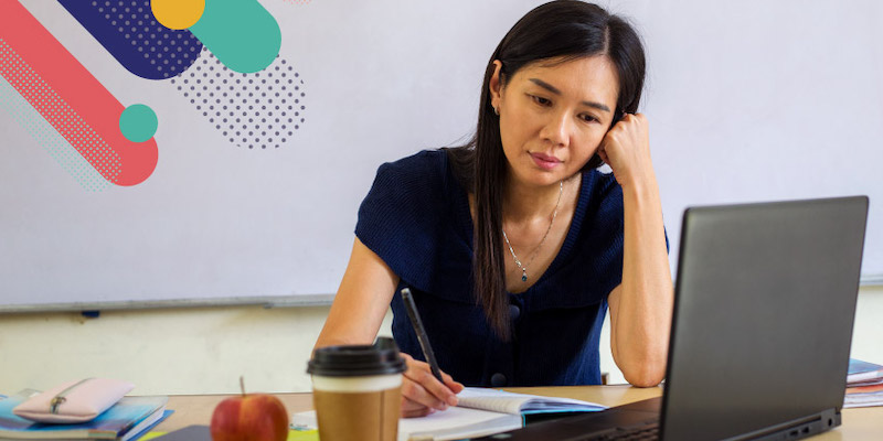 a teacher staring at a computer screen looking frustrated about how teachers are burned out