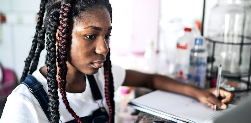 a Black student in a classroom looking anxious about STEM education 