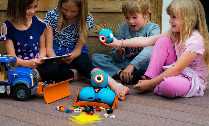 students using dash robot outdoors as part of a summer camp for STEM