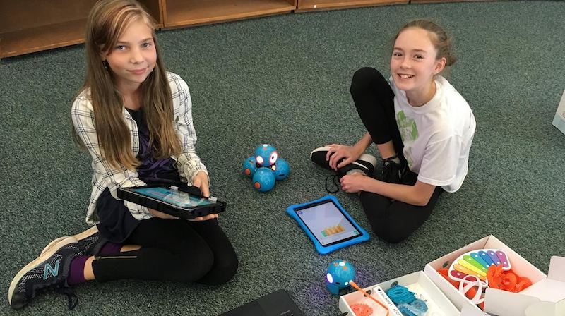 students using the dash robot in a school robotics club