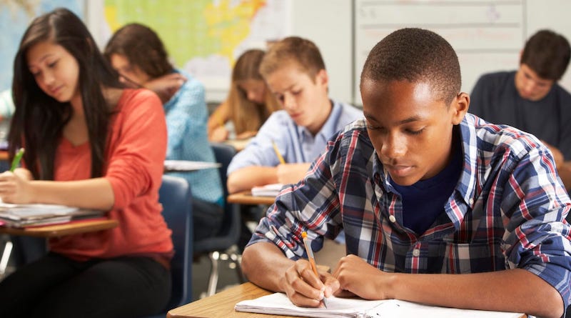 students taking notes in a classroom illustrating thoughts on equity in education