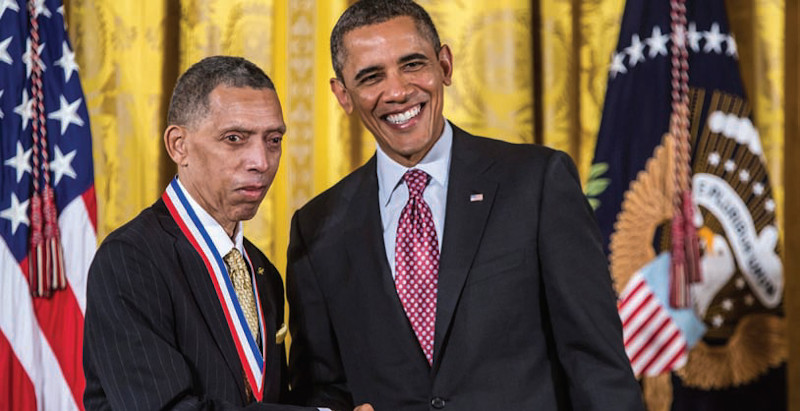 george carruthers receiving a STEM award from president barack obama