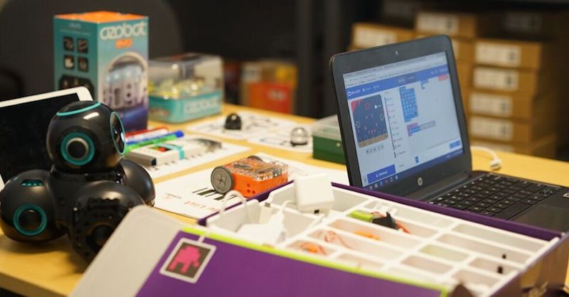 a group of STEM tools, including classroom robots, sitting on a table