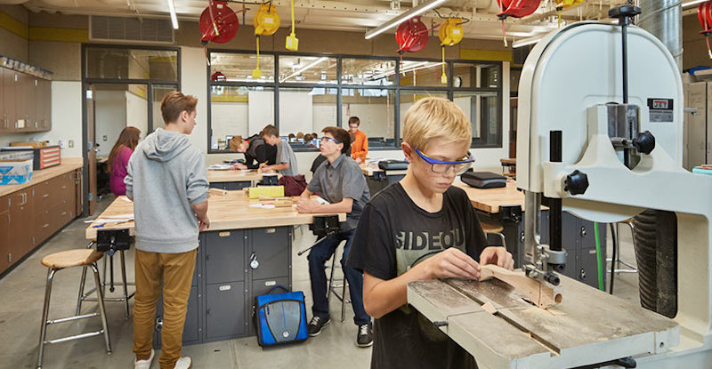 CTE students work with high-tech equipment in a high school makerspace