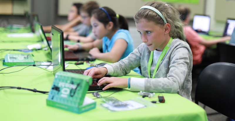 a young student coding with a micro:bit in school