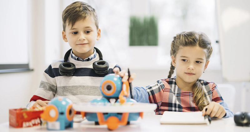 two young students using educational robotics tools after an edtech purchase