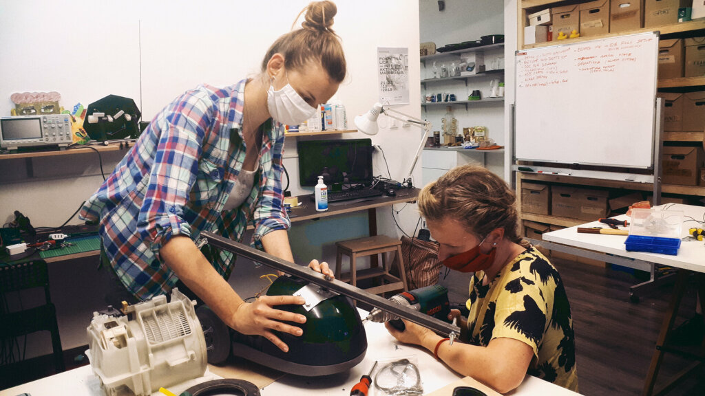 students working on a fabrication project in a makerspace