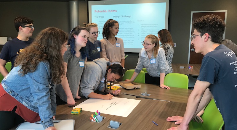 students in a discussion while using a design thinking approach in the classroom