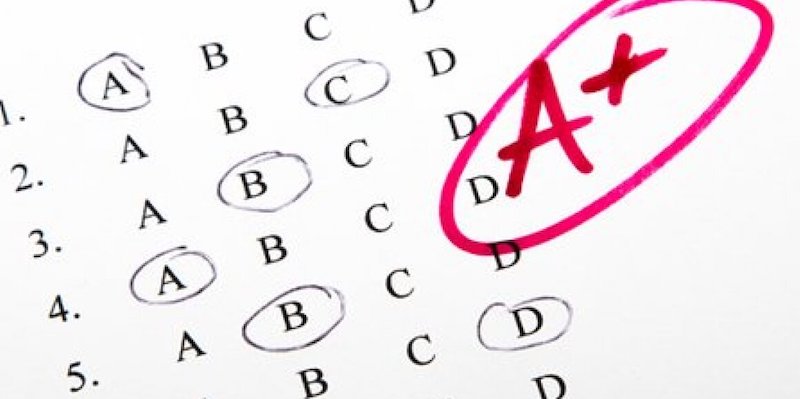 student test scores on a piece of paper the opposite of a gradeless classroom