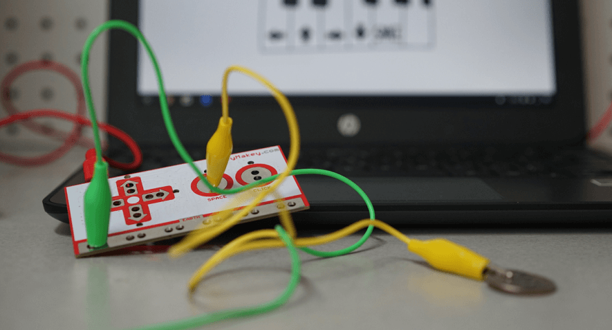 the makey makey stem kit connected to a computer