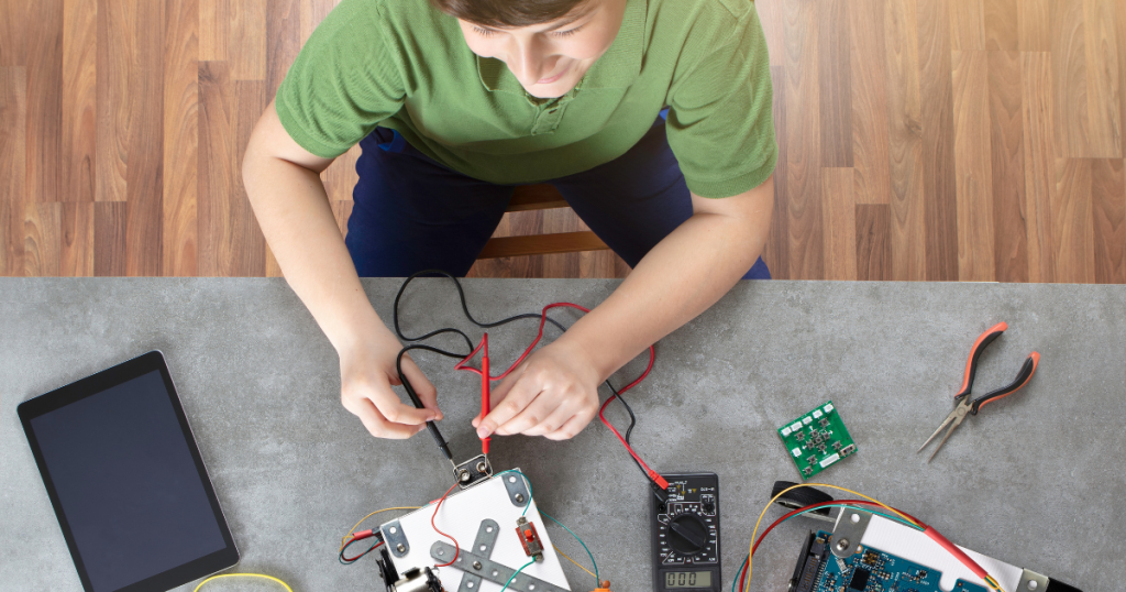 a student working on developing an entrepreneurial mindset by building a programmable robot