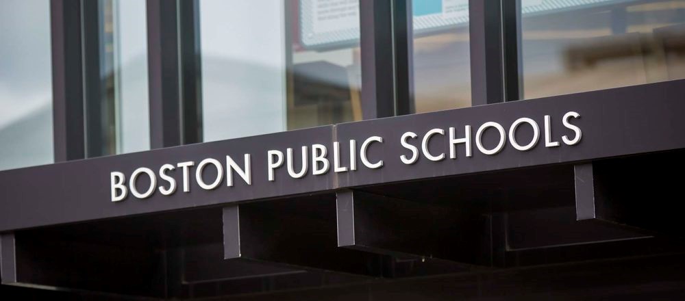 The sign for the Boston Public School headquarters on the front entrance of the Bruce Bolling Municipal Building in Dudley Sq. (Jesse Costa/WBUR)