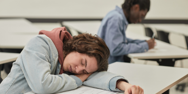 a student disengaged and sleeping in the classroom