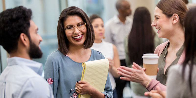 a group of teachers laughing during a school PD session