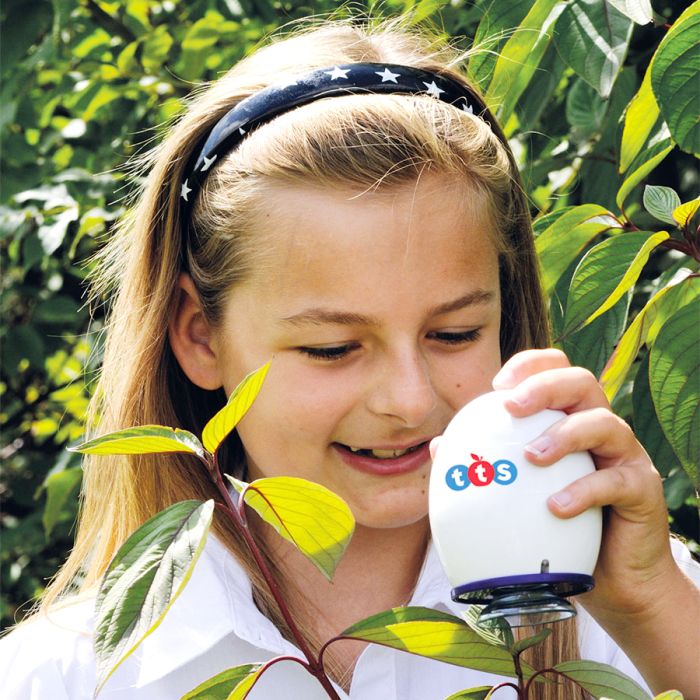 a student looking at the environment with a digital microscope