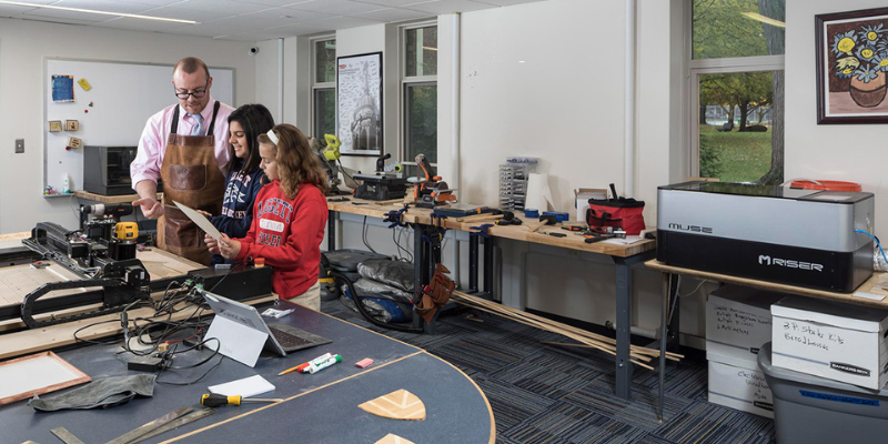 nicholas provenzano with students in a makerspace