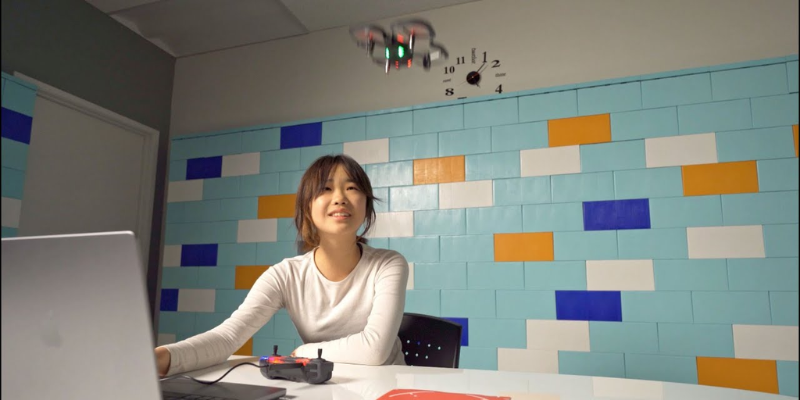 a student flying the CoDrone EDU drone in a classroom