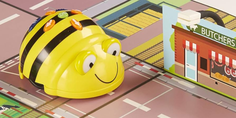 the bee-bot sitting on a classroom mat