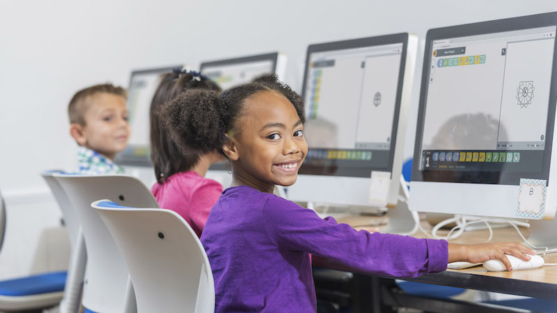 a group of students coding with the virtual root robot