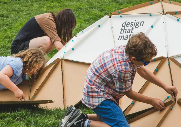 students using makedo to build structures at summer camp