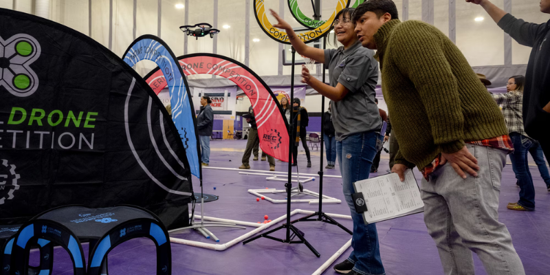 students and teachers at the aerial drone competition